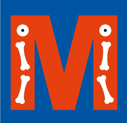 a young boy sitting on top of a large rock